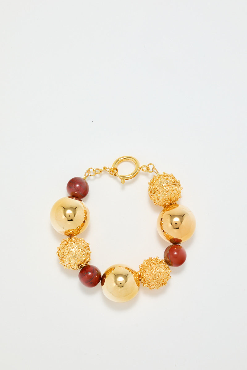 Gold Bracelet With Red Pearl Detail