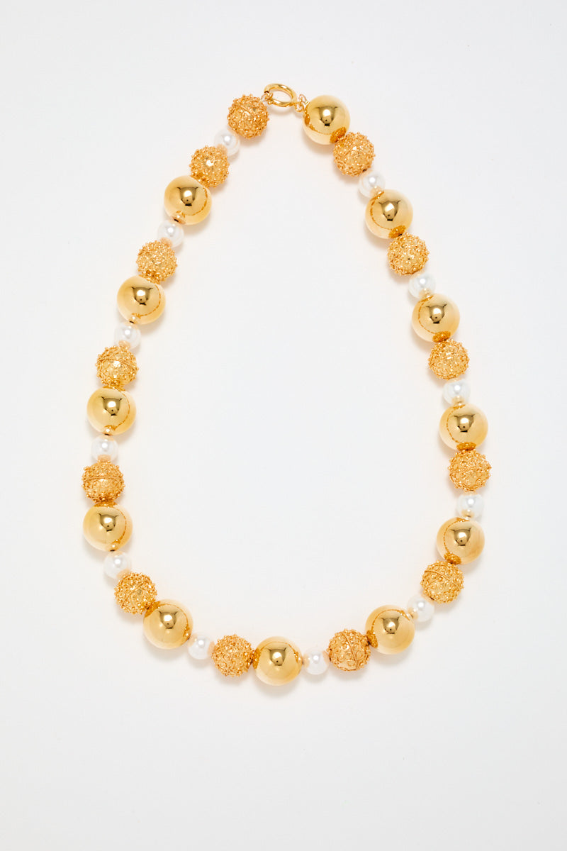 Gold Sculptural Necklace With White Pearl Detail