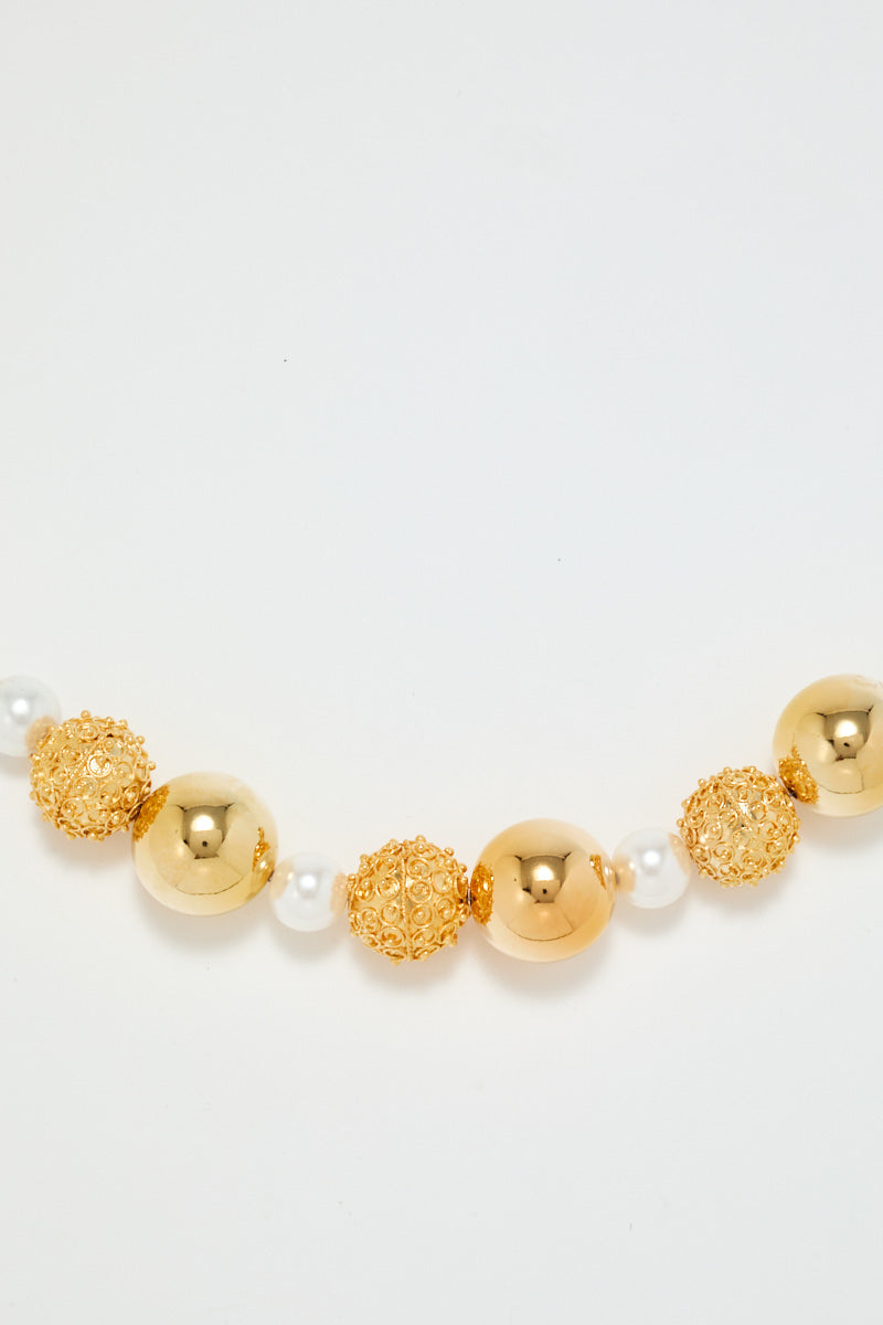 Gold Sculptural Necklace With White Pearl Detail