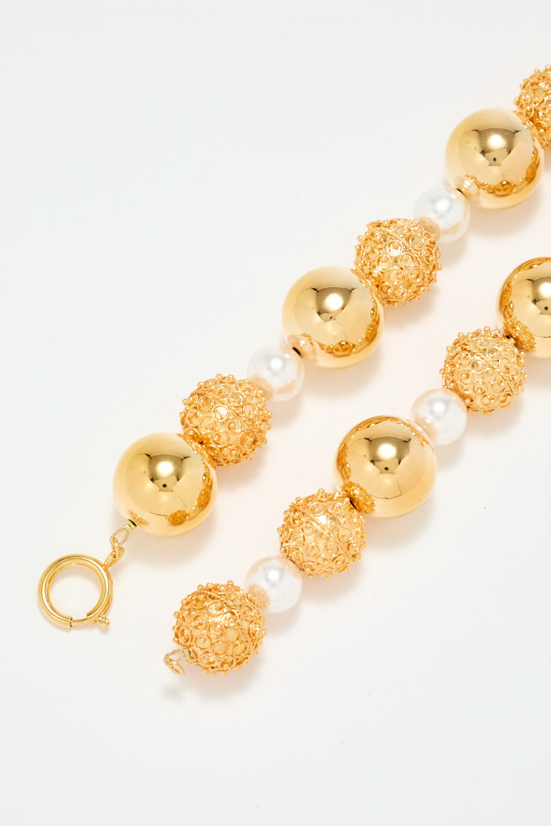 Gold Sculptural Necklace With White Pearl Detail