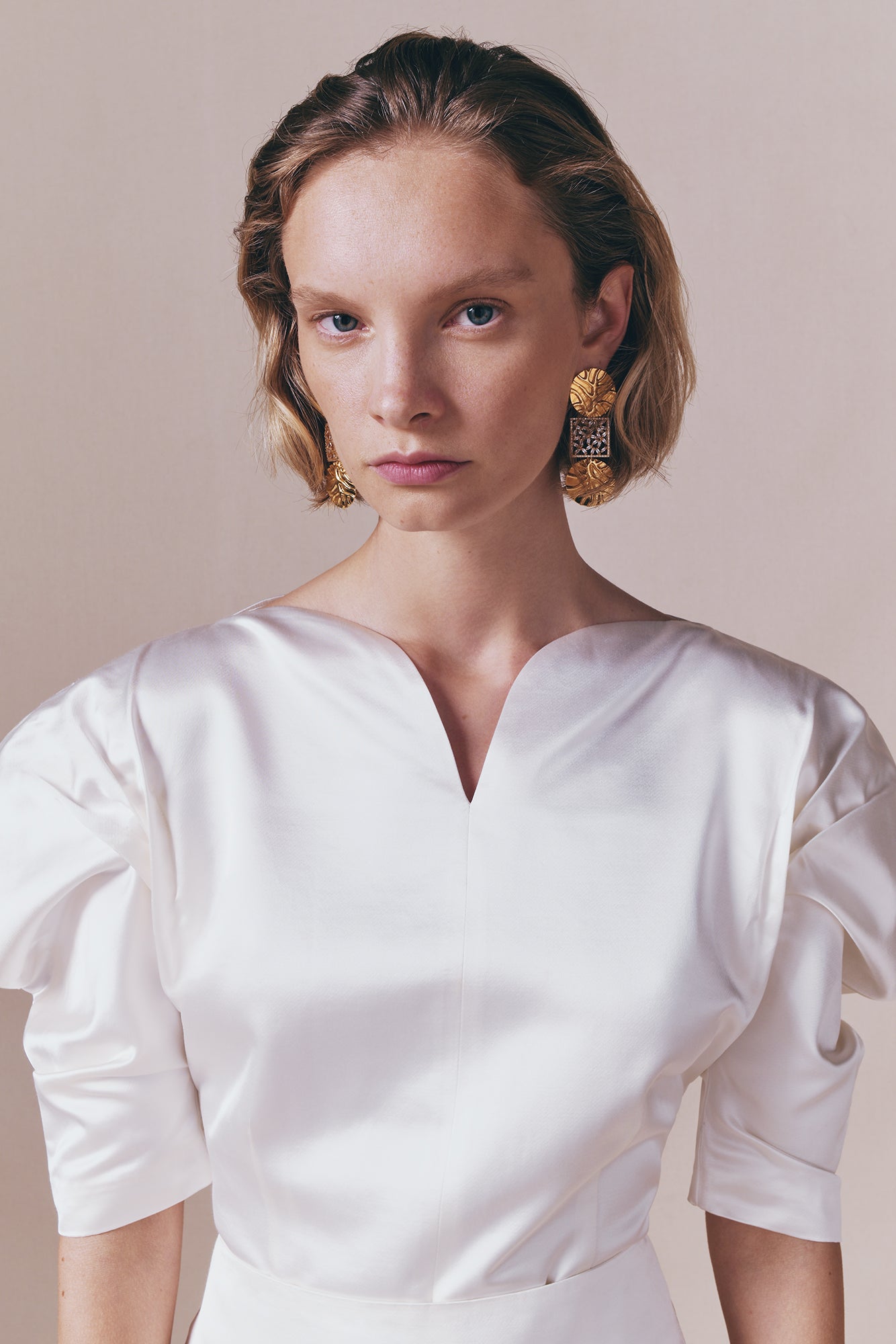 Gold Sculptural Drop Earrings With Ribbed Medallions